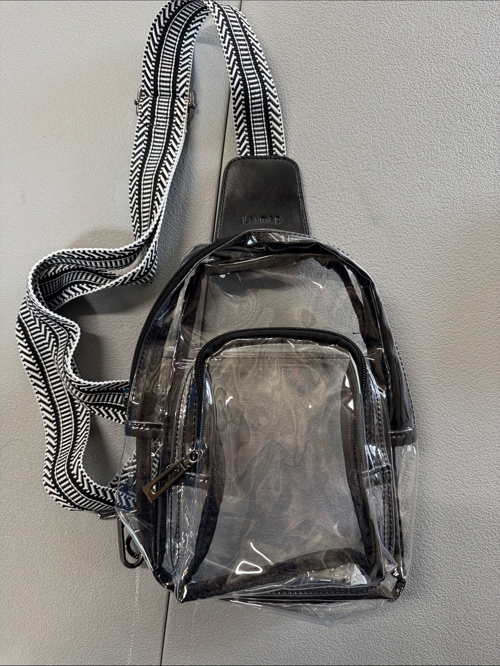 Clear Crossbody Sling Bag with Black Trim and Patterned Strap
